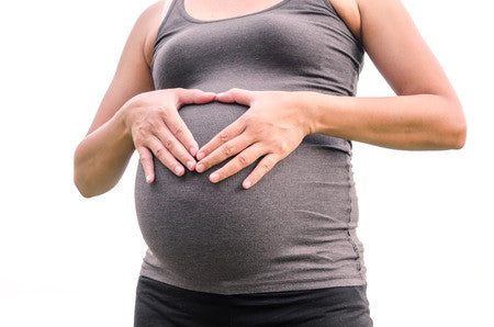 Image of pregnant woman holding her belly.